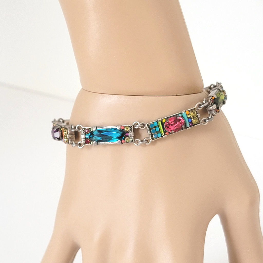Firefly brand crystal bracelet displayed on wrist.