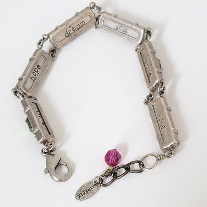 Inside view of Firefly bracelet, showing dream, hope, imagine text.