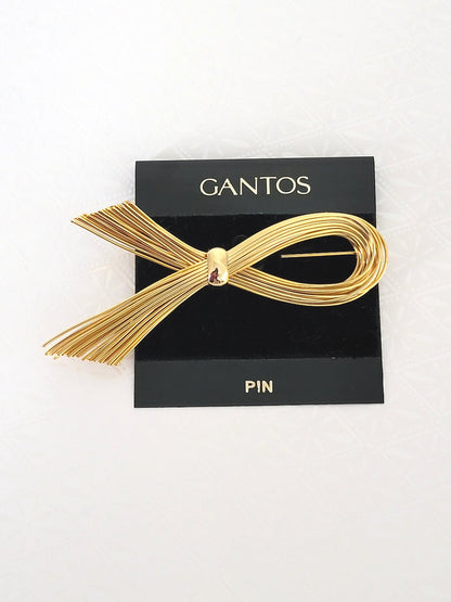 Vintage gold tone wire modernist style brooch, by Gantos, with original card.