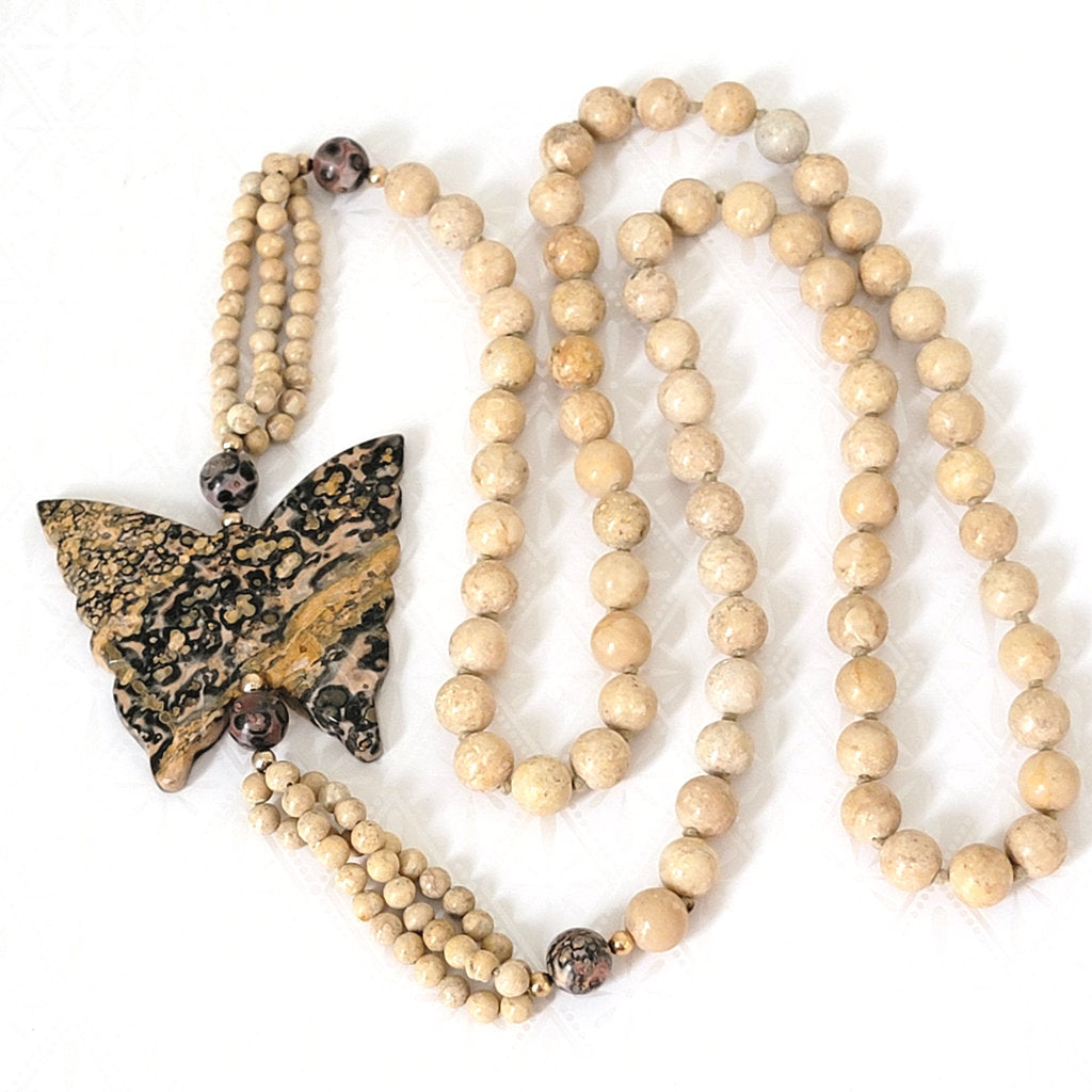 Carved stone butterfly beaded necklace.