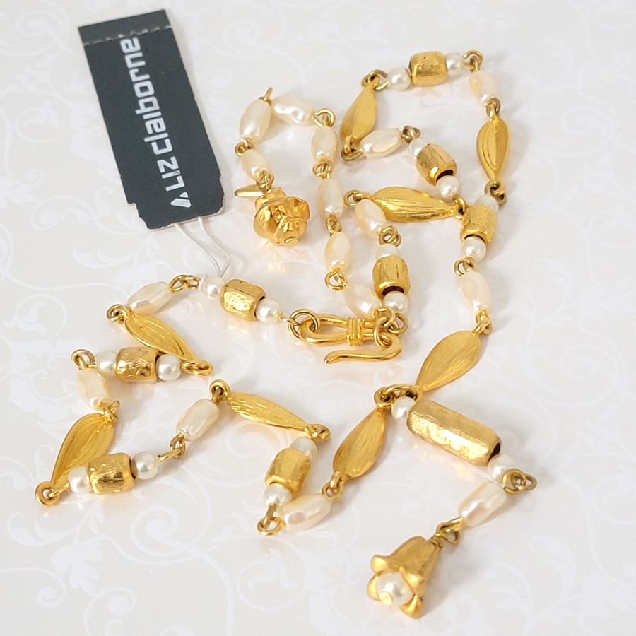 Liz Claiborne faux pearl and gold tone Y style necklace with hang tag.
