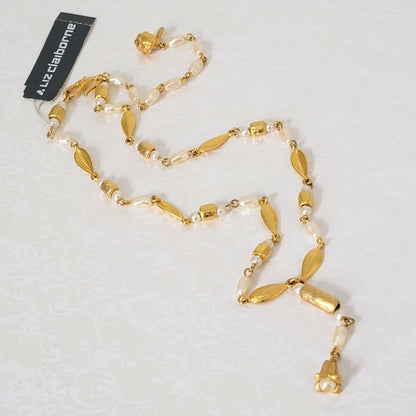 Liz Claiborne faux pearl and gold tone Y style choker necklace.