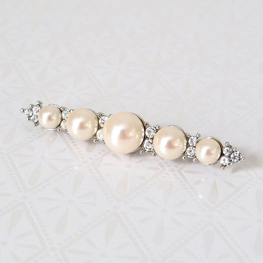 Monet faux pearl and rhinestone bar brooch, in silver tone metal.