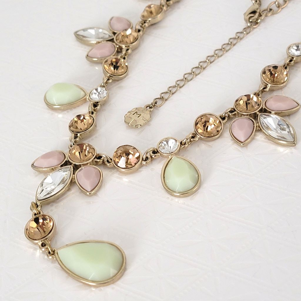 Monet pink and green Y style necklace with logo tag.