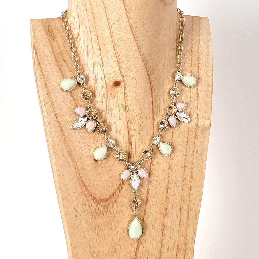 Monet mint green, pink and champagne rhinestone necklace on display.