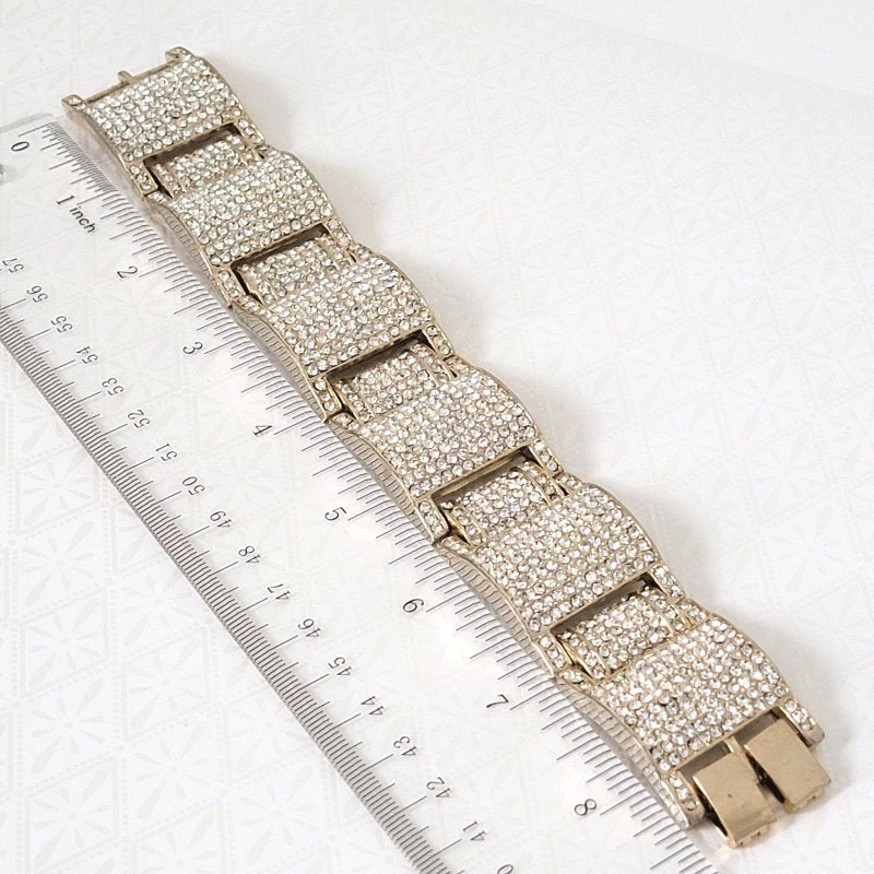 Big, heavy pave rhinestone bling bracelet, next to a ruler.