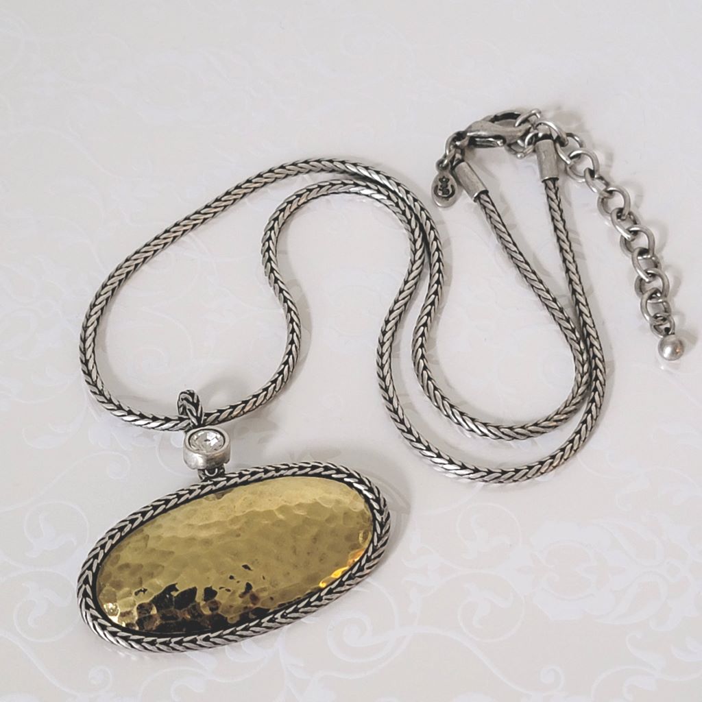Premier Designs oval pendant choker in hammered gold and silver tone, with foxtail chain and crystal accent.