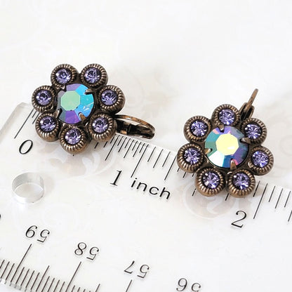Kirks Folly purple crystal flower cluster earrings, next to a ruler.