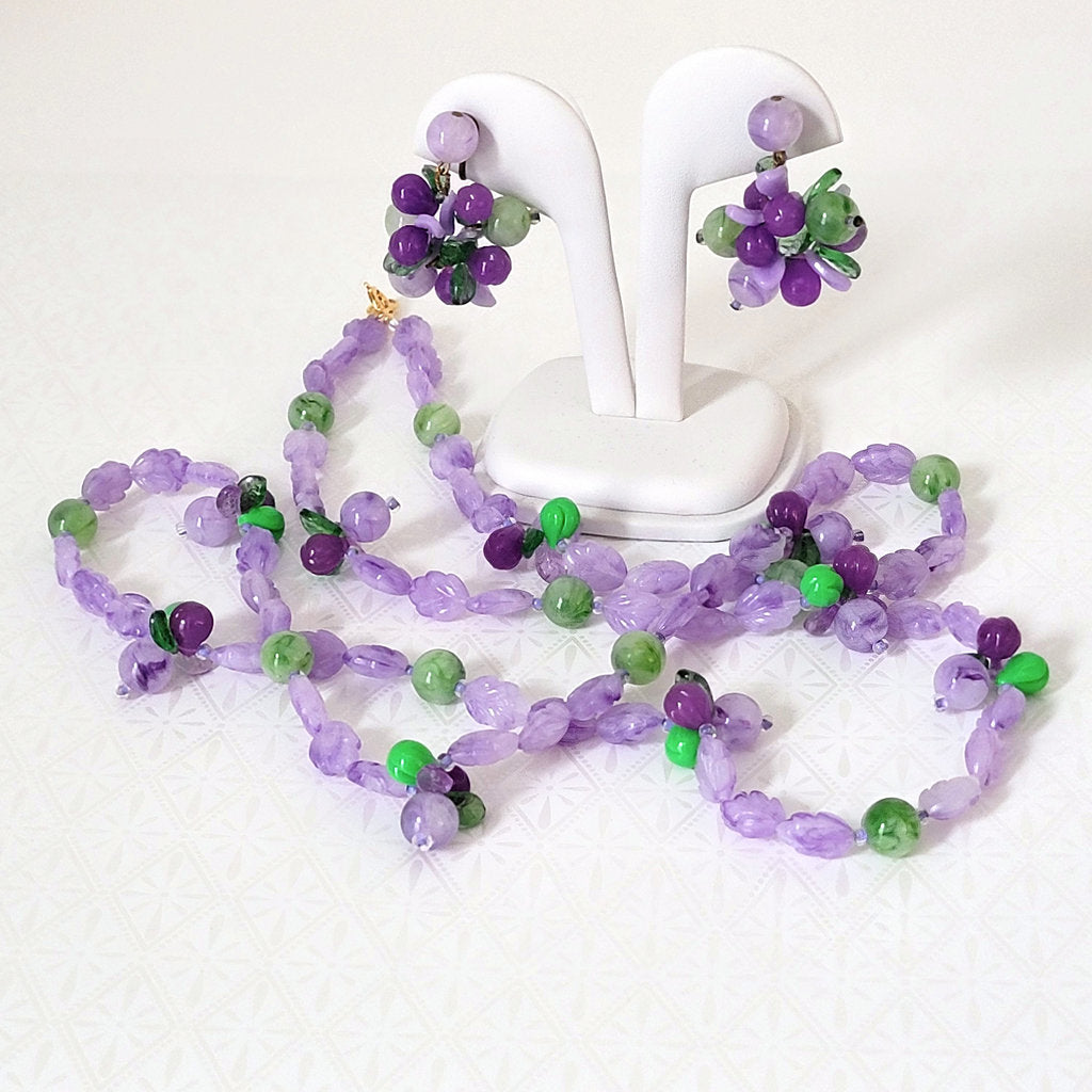 Vintage purple and green lucite plastic, beaded necklace and clip on earrings set.