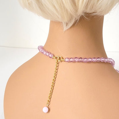 Back view of purple leaves necklace, shown on a mannequin