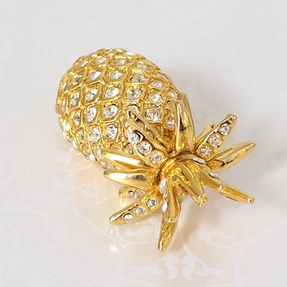 Top view of rhinestone pineapple brooch.