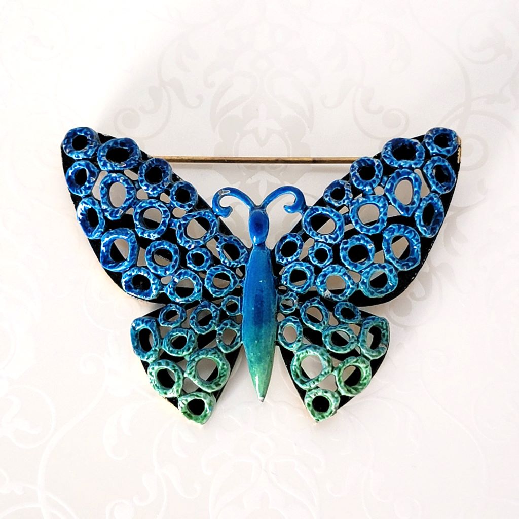 Vintage blue and green enamel butterfly brooch, ombre effect, with open circles design.