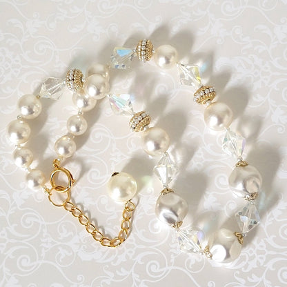 Vintage chunky faux pearl choker, with aurora borealis accents and extender chain.