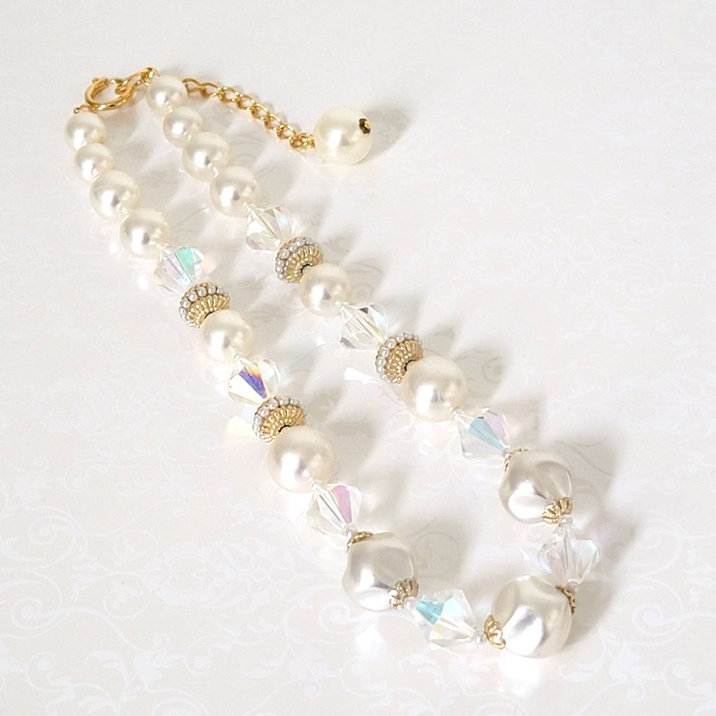 Vintage faux pearl and glass choker, with gold tone accents and extender chain.