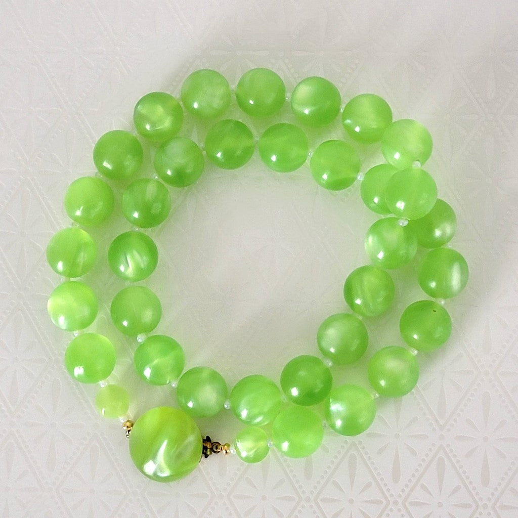 Vintage bright green plastic beaded moonglow necklace, with matching clasp.