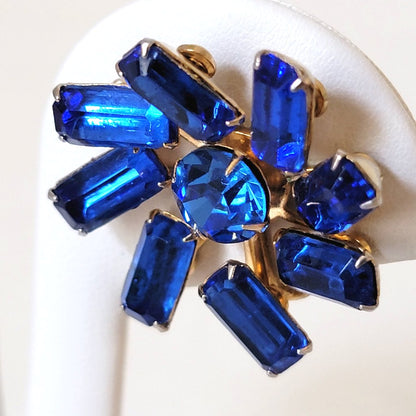 Vintage sapphire blue, baguette rhinestone clip on earrings, with a pinwheel style prong setting.