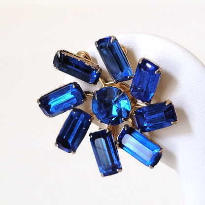 Vintage sapphire blue, baguette rhinestone clip on earrings, with a pinwheel style prong setting.