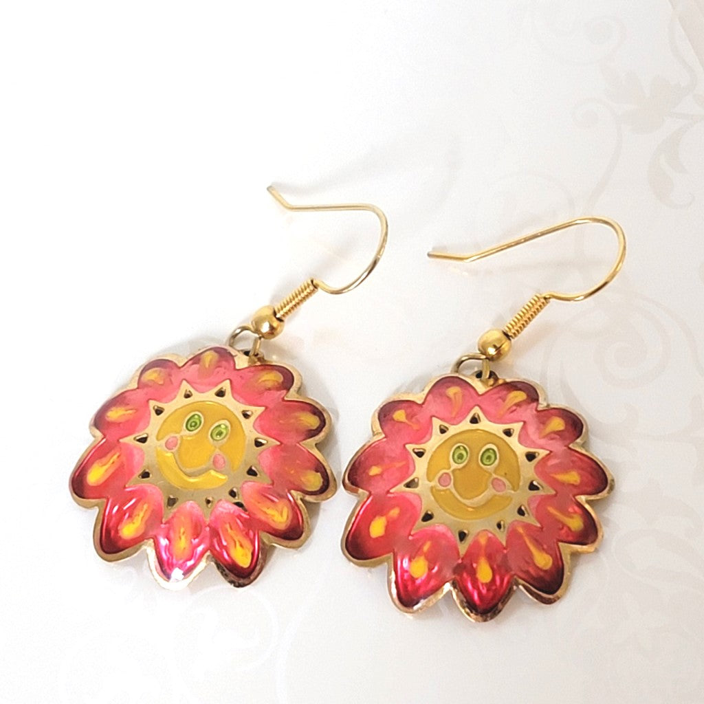 Vintage Two Hands brand pink and yellow enamel flower dangle earrings, with smiley faces and green eyes.