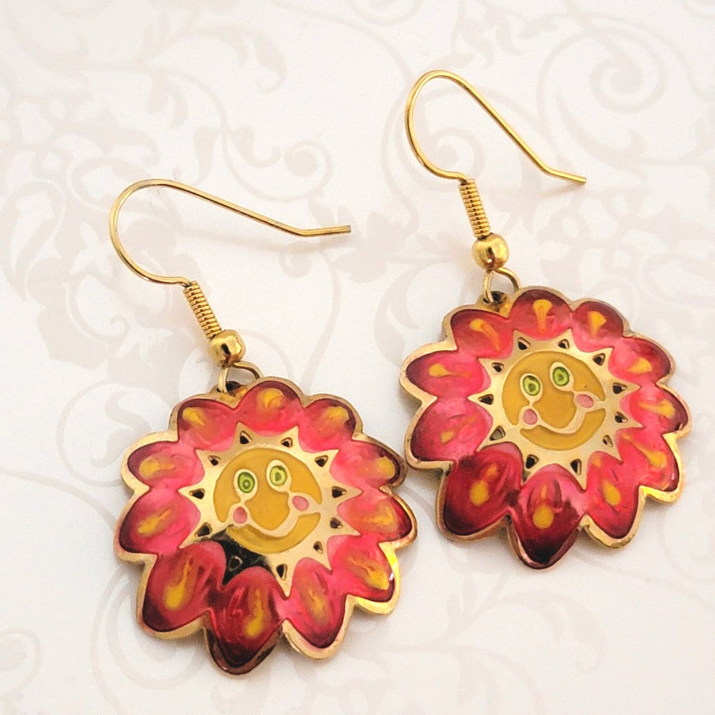 Vintage Two Hands brand pink and yellow enamel flower dangle earrings, with smiley faces and green eyes.