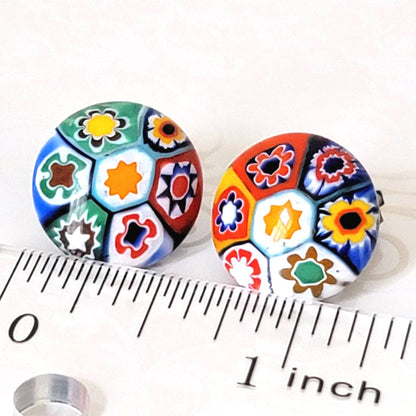 Multicolor vintage millefiori glass clip-on earrings, shown next to a ruler.