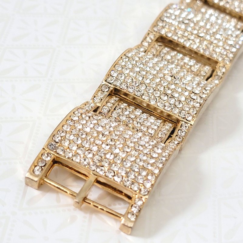 Closeup of chunky pave rhinestone bling bracelet, clasp end.